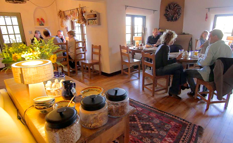Visitors Enjoying a home made Breakfast at Old Taos Guesthouse